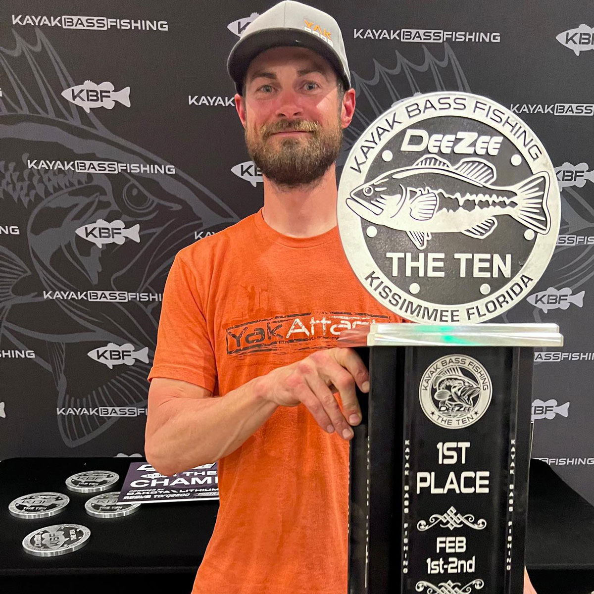 Cody Henley holding up THE TEN trophy